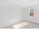 Bright bedroom featuring neutral walls, carpet, and a window with natural light at 240 Sequoia Dr, Louisburg, NC 27549