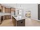 View of kitchen and living room showing ample storage space, natural light, and backyard deck access at 240 Sequoia Dr, Louisburg, NC 27549