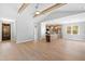 Open concept living room and kitchen offers an open feel with wood beam ceiling accents at 240 Sequoia Dr, Louisburg, NC 27549