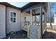 Side view of covered porch with wooden stairs and outdoor ceiling fan at 240 Sequoia Dr, Louisburg, NC 27549