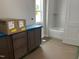 Bathroom featuring modern vanity, tub, and tiled shower at 2408 Adrift Road, Fuquay Varina, NC 27526