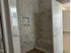 Modern bathroom with a stylish marble-tiled walk-in shower and niche at 2408 Adrift Road, Fuquay Varina, NC 27526
