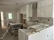 Spacious kitchen area awaiting countertops, paint, and appliances at 2408 Adrift Road, Fuquay Varina, NC 27526