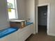 Functional laundry room with ample counter space and storage at 2408 Adrift Road, Fuquay Varina, NC 27526