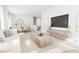 Spacious living room flows into dining area and features modern decor and natural light at 2408 Adrift Road, Fuquay Varina, NC 27526