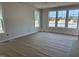 Spacious living room with large windows offering ample natural light at 2408 Adrift Road, Fuquay Varina, NC 27526