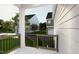 Inviting porch with black railings provides outdoor living space with a view of the neighborhood at 2408 Adrift Road, Fuquay Varina, NC 27526