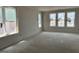 Bright room with several windows awaiting paint and flooring at 2408 Adrift Road, Fuquay Varina, NC 27526