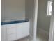 New bathroom features a white vanity, white countertop, and a mirror ready for finishing touches at 2412 Adrift Road, Fuquay Varina, NC 27526