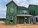 This is a two-story home under construction with visible ZIP System sheathing and white windows at 2412 Adrift Road, Fuquay Varina, NC 27526