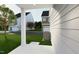 View of a home's side and front yard featuring lush green grass and fresh landscaping; a charming neighborhood at 2412 Adrift Road, Fuquay Varina, NC 27526