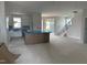 Open-concept interior with natural light, showcasing the kitchen area with island, stairs and a modern design at 2412 Adrift Road, Fuquay Varina, NC 27526