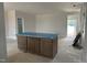 Open-concept interior featuring a central kitchen island, providing ample counter space and storage, and modern design at 2412 Adrift Road, Fuquay Varina, NC 27526