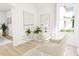 This office features a glass desk, plants, and natural light at 2412 Adrift Road, Fuquay Varina, NC 27526