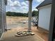View from outdoor deck with newly installed wood flooring and materials, with construction still in progress at 2412 Adrift Road, Fuquay Varina, NC 27526
