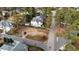 Aerial view of lot showing mature trees and desirable neighborhood at 3301 Dell Dr, Raleigh, NC 27609