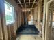 Framed bathroom with plumbing and shower base in new construction home at 3301 Dell Dr, Raleigh, NC 27609