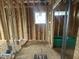 New construction bathroom with stud framing, plumbing, and an green tub at 3301 Dell Dr, Raleigh, NC 27609