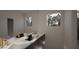 Contemporary bathroom featuring double sinks, a sleek vanity, and ample natural light from windows at 3301 Dell Dr, Raleigh, NC 27609