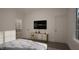Spacious bedroom with TV and access to upper floor at 3301 Dell Dr, Raleigh, NC 27609