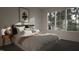 Peaceful bedroom with large window and neutral decor at 3301 Dell Dr, Raleigh, NC 27609