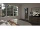 Main bedroom with ensuite bathroom and window views at 3301 Dell Dr, Raleigh, NC 27609