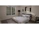 Bright bedroom with large window and comfortable bed at 3301 Dell Dr, Raleigh, NC 27609