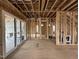 Unfinished Dining Room framing with sliding door and multiple views to other rooms at 3301 Dell Dr, Raleigh, NC 27609