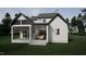 Modern farmhouse exterior with large screened porch at 3301 Dell Dr, Raleigh, NC 27609