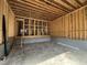 Unfinished two-car garage with concrete floor, framed walls, and open ceiling rafters awaiting final construction and customization at 3301 Dell Dr, Raleigh, NC 27609