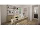 Bright home office with built-in shelving and a spacious desk at 3301 Dell Dr, Raleigh, NC 27609