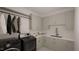 Laundry room with washer, dryer, and ample cabinet space at 3301 Dell Dr, Raleigh, NC 27609