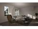 Relaxing living room with comfy seating and large windows at 3301 Dell Dr, Raleigh, NC 27609