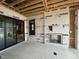The covered patio features a fireplace, floor to ceiling windows, and sliding glass doors at 3301 Dell Dr, Raleigh, NC 27609