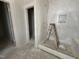 Neutral-toned bathroom featuring a step-in shower with white tiling at 2400 Adrift Rd, Fuquay Varina, NC 27526