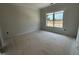 Neutral room with large window providing abundant natural light at 2400 Adrift Rd, Fuquay Varina, NC 27526