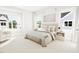 Bright bedroom featuring a neutral color scheme, large windows, and stylish decor at 2400 Adrift Rd, Fuquay Varina, NC 27526