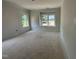 Light filled bedroom featuring two windows and neutral walls at 2400 Adrift Rd, Fuquay Varina, NC 27526
