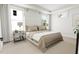Calming bedroom with a tufted headboard, neutral tones, and plenty of natural light at 2400 Adrift Rd, Fuquay Varina, NC 27526