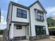 New two-story home boasts white siding, black trim, and stone accents at 2400 Adrift Rd, Fuquay Varina, NC 27526
