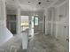 Spacious living area features drywall, stairs, and access to a deck at 2400 Adrift Rd, Fuquay Varina, NC 27526