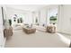 Bright and spacious living room with large windows and comfortable seating at 2400 Adrift Rd, Fuquay Varina, NC 27526