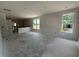 Expansive open concept living room featuring neutral walls and bright natural light at 2400 Adrift Rd, Fuquay Varina, NC 27526