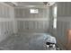 Unfinished living room with natural light, ideal for creating a personalized and comfortable living space at 2400 Adrift Rd, Fuquay Varina, NC 27526