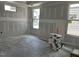 Spacious living room featuring bright windows and smooth, unfinished walls, providing a blank canvas for customization at 2400 Adrift Rd, Fuquay Varina, NC 27526