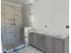 Bathroom features a modern tiled shower with niche and a stylish vanity, offering both functionality and style at 2404 Adrift Rd, Fuquay Varina, NC 27526