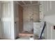 Modern bathroom shower with white marble-look tiles at 2404 Adrift Rd, Fuquay Varina, NC 27526