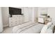 Bedroom featuring neutral decor, a desk, television, and comfortable furniture at 2404 Adrift Rd, Fuquay Varina, NC 27526