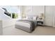 Comfortable bedroom featuring neutral colored walls, carpet, and view to the exterior at 2404 Adrift Rd, Fuquay Varina, NC 27526