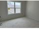 Bright bedroom with a large window, providing natural light, offering a comfortable living space at 2404 Adrift Rd, Fuquay Varina, NC 27526